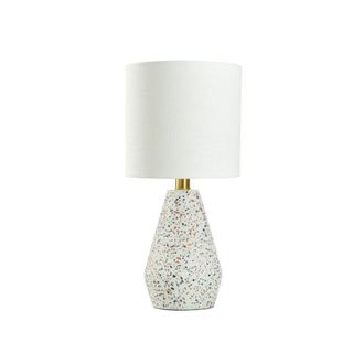 A white table lamp with a geometric base