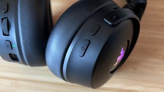 Close up on haptic and multi-function buttons on Razer Kraken V4 Pro right earcup