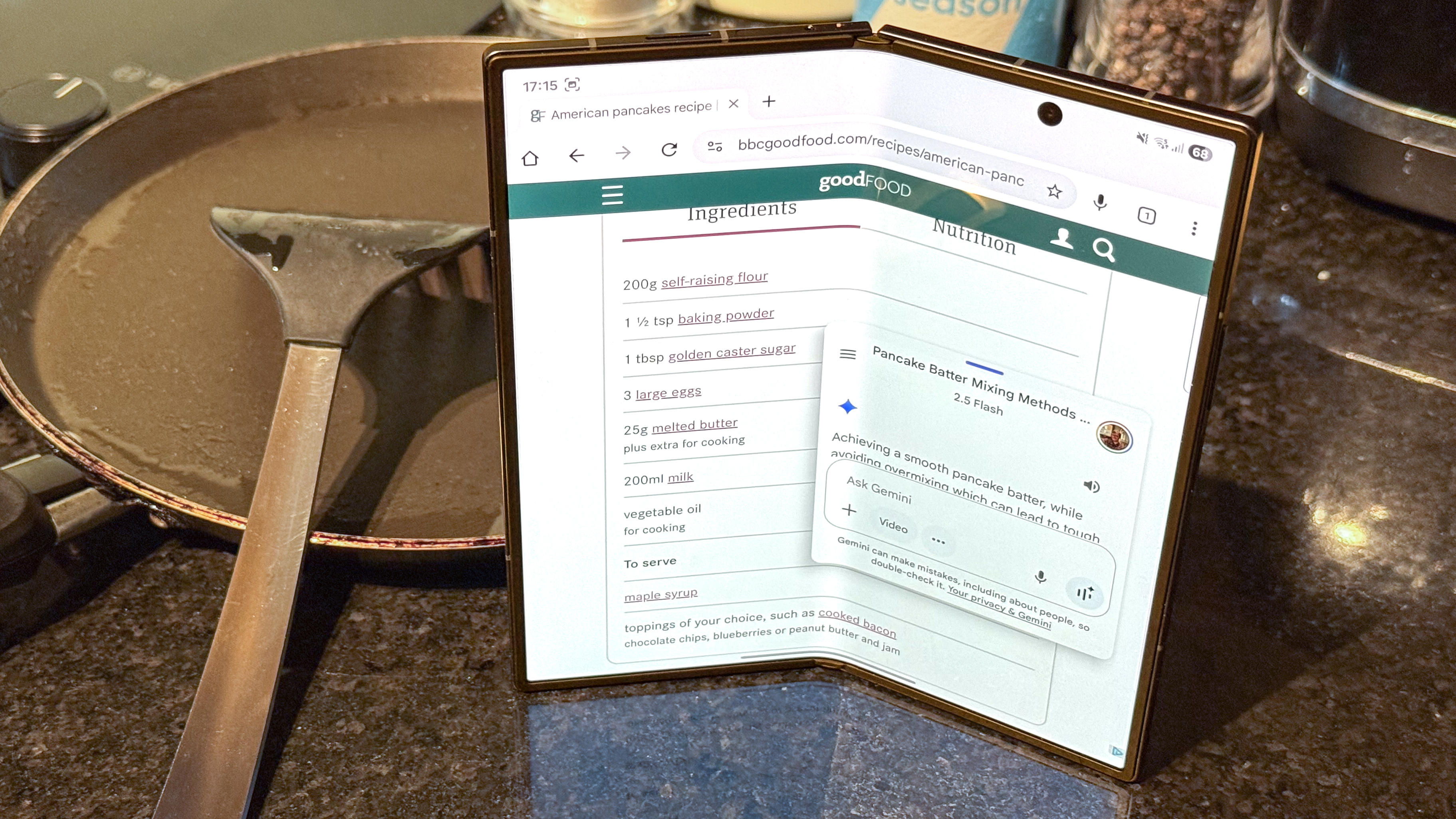 Samsung Galaxy Z Fold 7 using Gemini for pancake mixing tips, near a pan and spatula