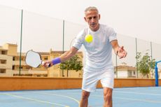Man Playing Pickleball Outdoors