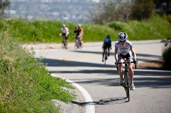 Marra Abbott (Peanut Butter &amp; Co) passing riders on the way to her win