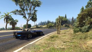 GTA 5 mods - a black car driving along a road