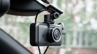 Miofive S1 Ultra dashcam in a car window