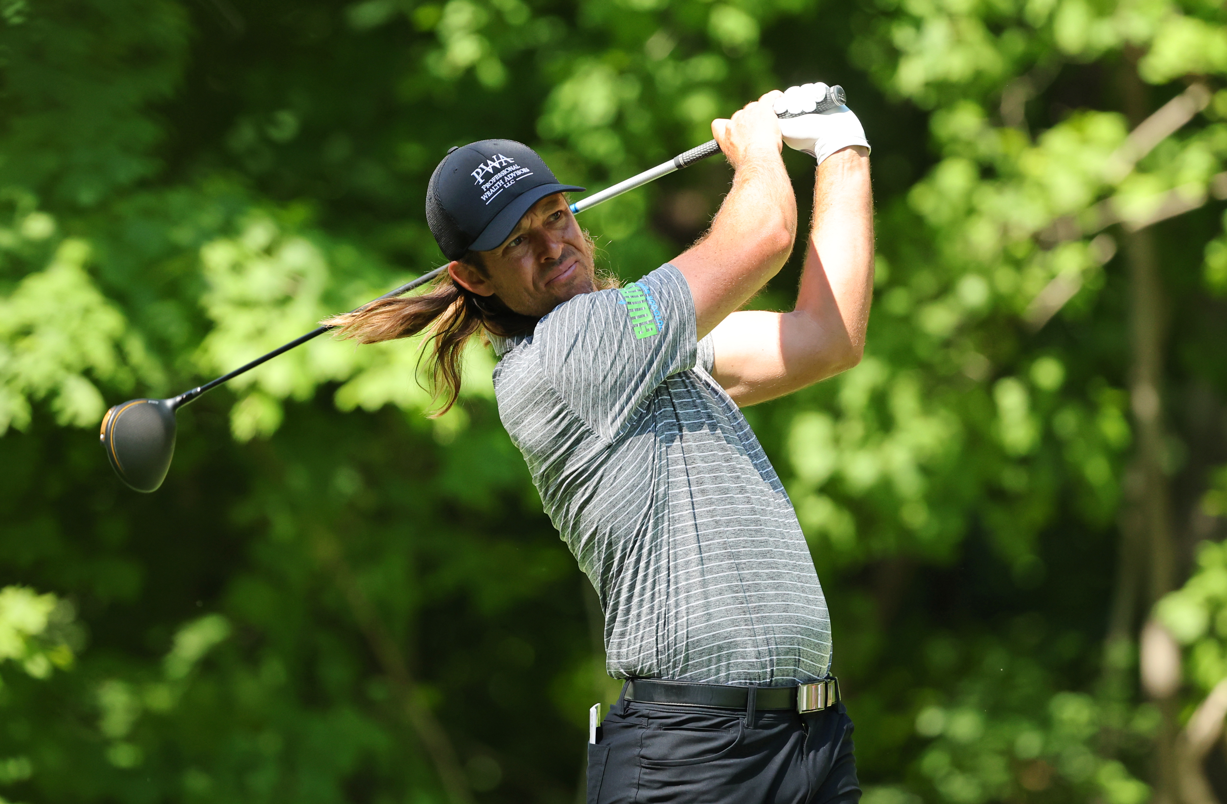 Aaron Baddeley hits a tee shot with a driver
