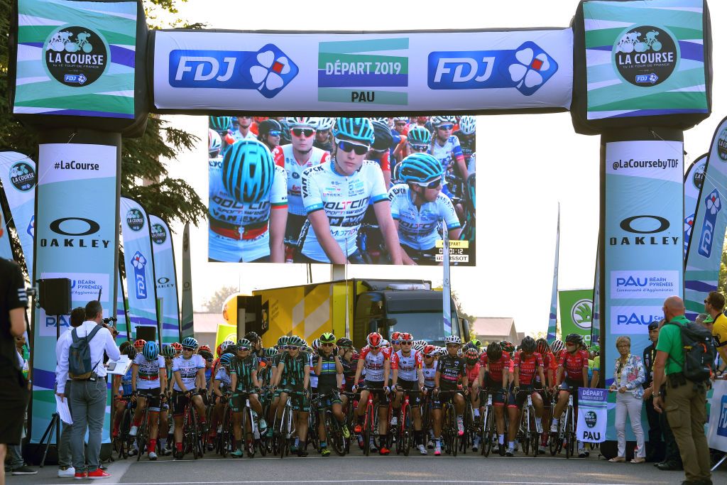 The riders line-up for the early start