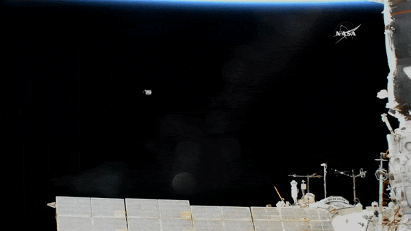 The jettisoned electronics box floats away from the International Space Station. It will eventually fall to Earth and burn up in the atmosphere.