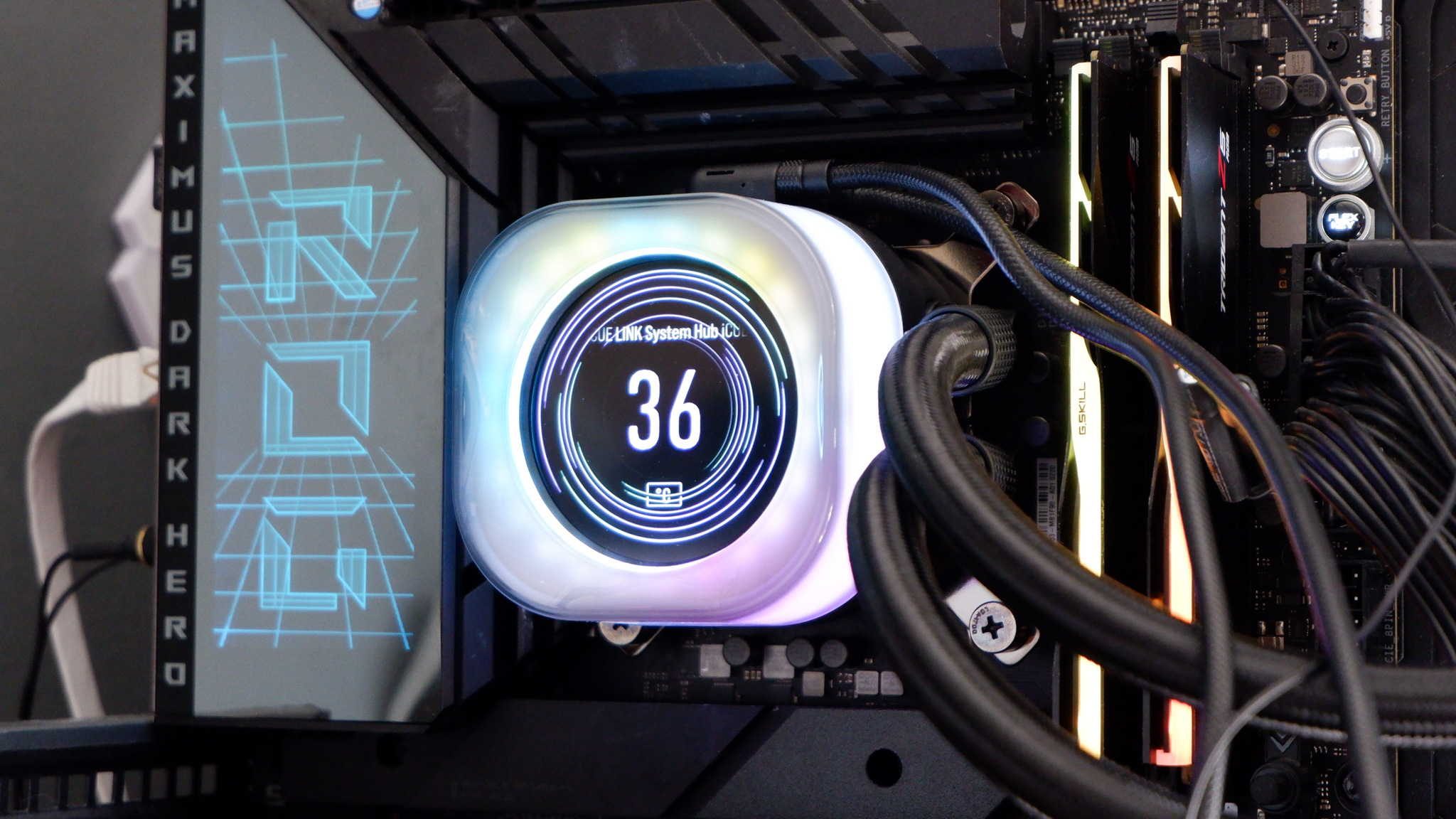 Corsair iCUE Link Titan 360 RX LCD liquid cooler set up on a test bench.