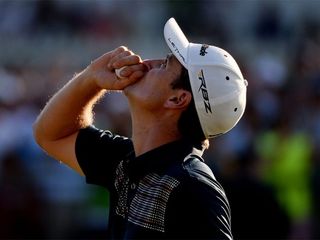 ARDMORE, PA - JUNE 16: Justin Rose of England looks to the heavens in acknowledgement of his deceased father after putting on the 18th hole to complete the final round of the 113th U.S. Open at Merion Golf Club on June 16, 2013 in Ardmore, Pennsylvania. (Photo by Ross Kinnaird/Getty Images)