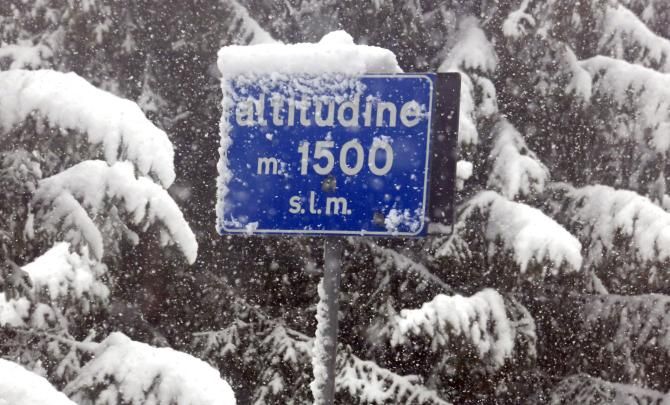 Snow adorns a sign on the Passo del Tonale, ahead of the cancelled stage of the Giro