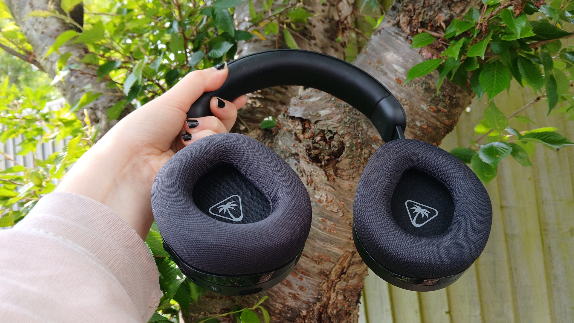 The Turtle Beach Stealth 600 gaming headset outside with the microphone and buttons on show.