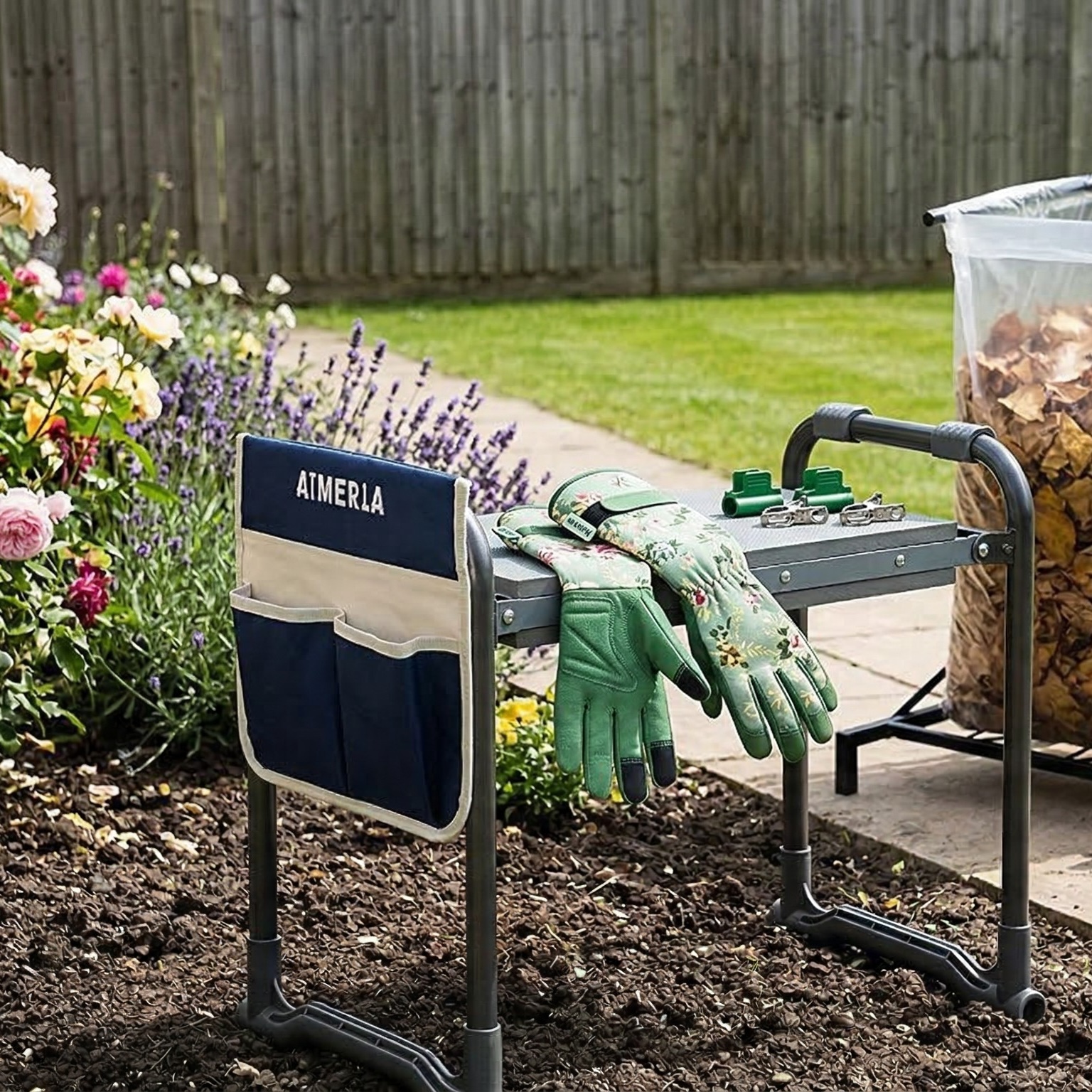 Ergonomic kneeler, gloves and rolling yard cart in garden.