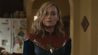 Brie Larson's Captain Marvel with a wide-eyed look in the Khan house in The Marvels