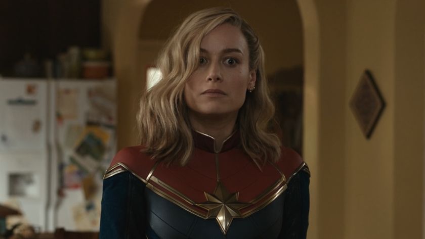 Brie Larson&#039;s Captain Marvel with a wide-eyed look in the Khan house in The Marvels