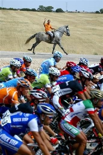 A horseman gallops along