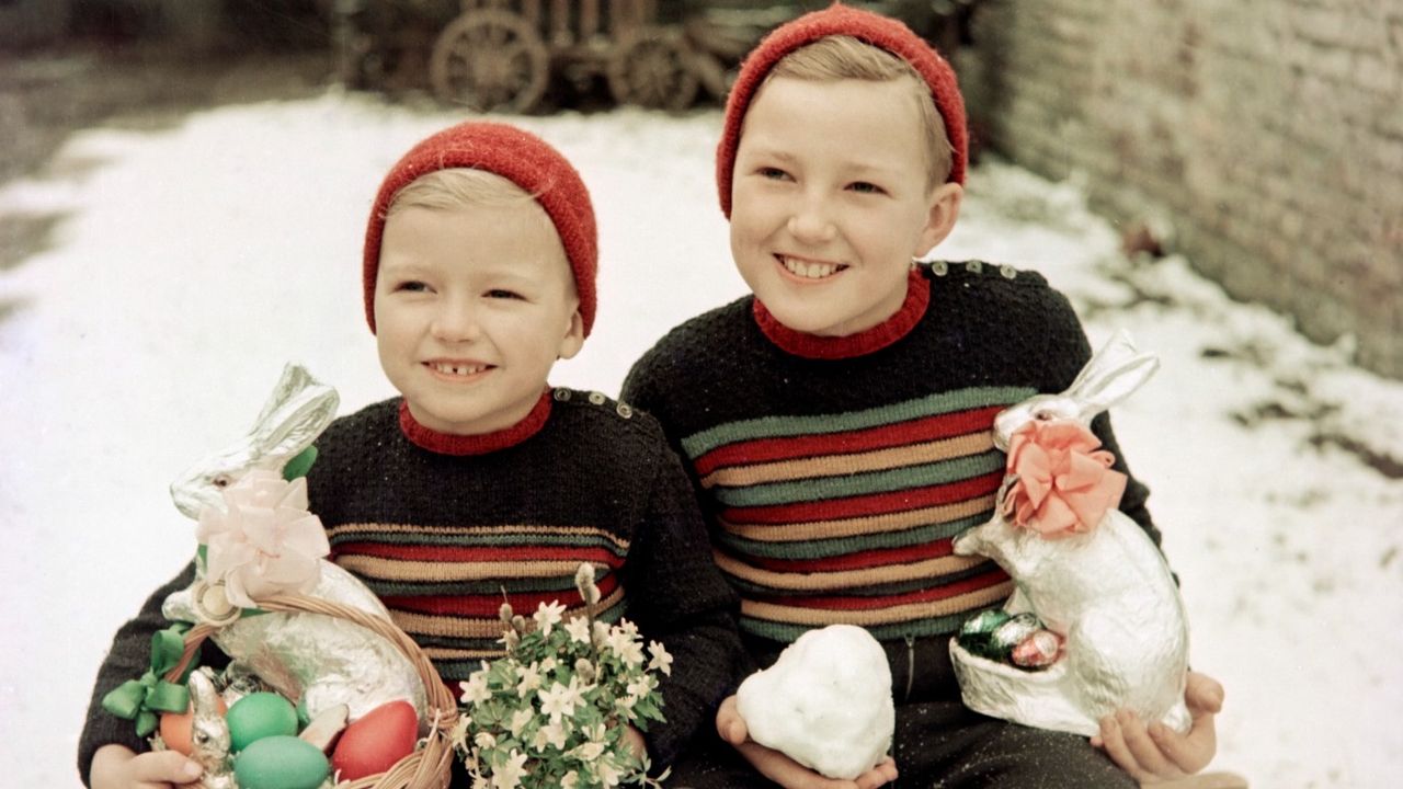 Two boys with Easter bunnies and snow