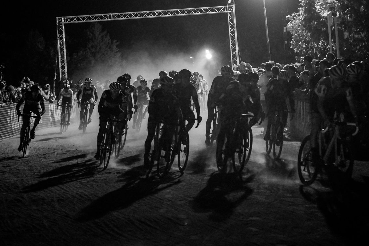Dust kicks up from the large mens field