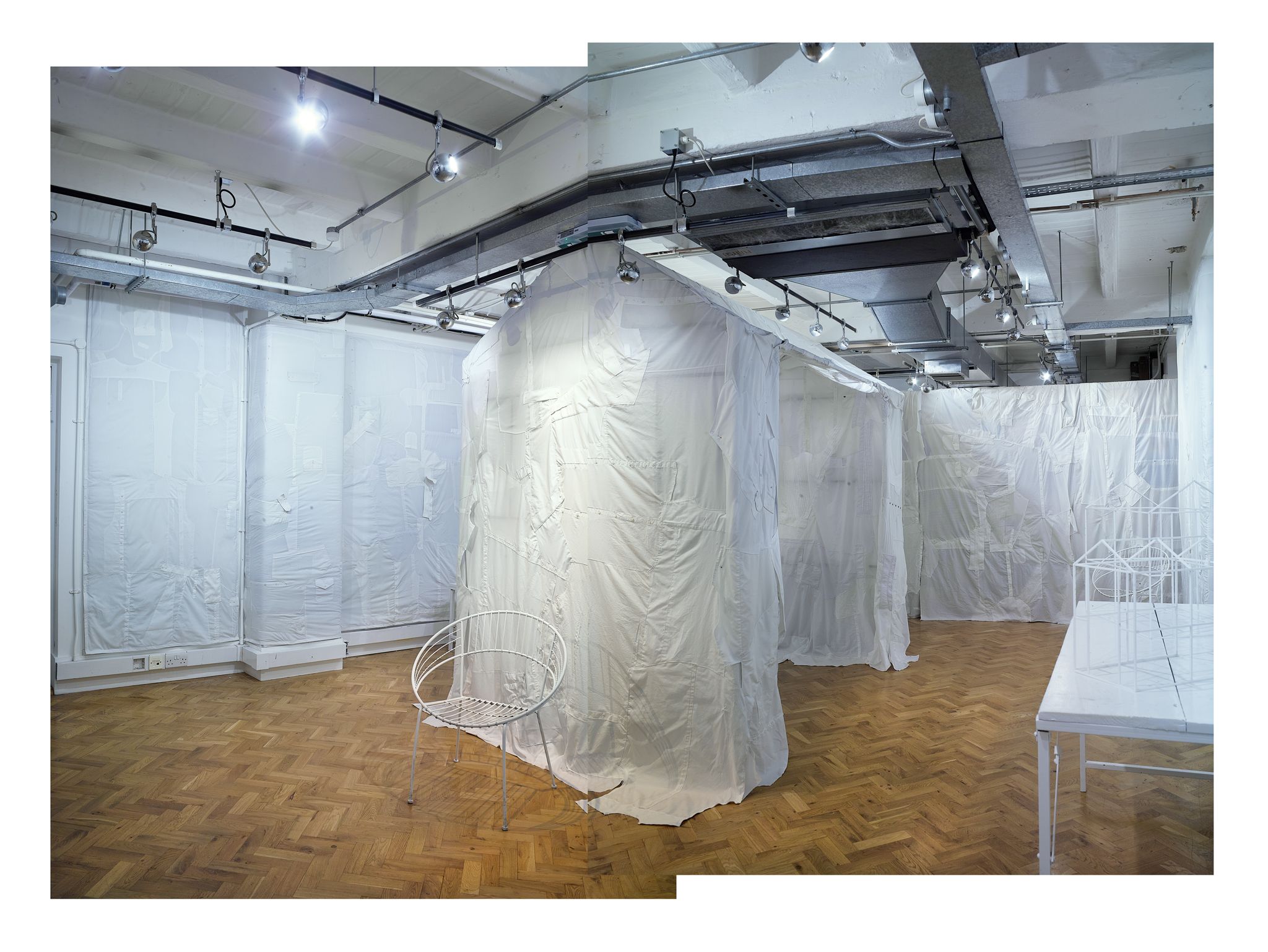 Harris Elliott's metamorphosing London ‘social salon' begins with a marketplace of white shirts