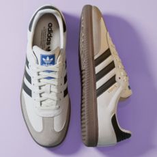 Photo of Adidas Samba in white and black colourway on light purple background