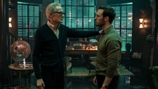 Bill Nighy touches Sam Claflin on the shoulder in a study