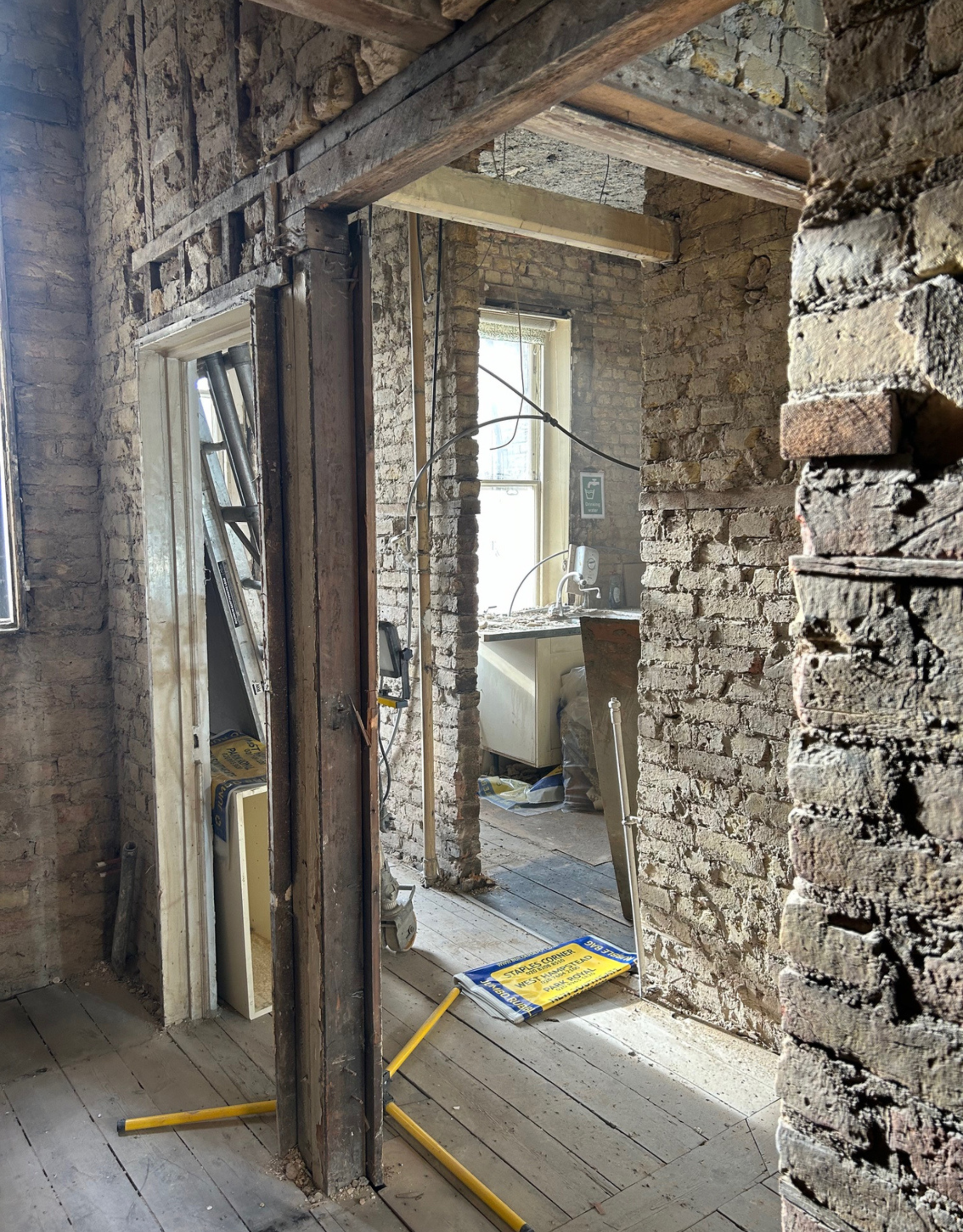 exposed brick building site with open beams