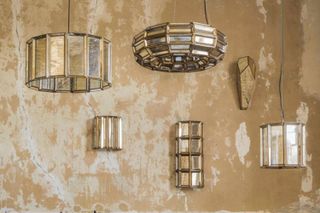 art deco design Mirrored art deco pendant lights against a stripped back wall