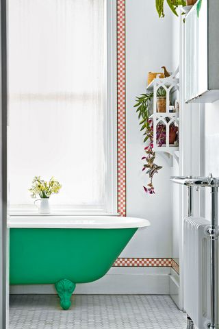 White bathroom with a checked Ernie wallpaper border from Susie Atkinson