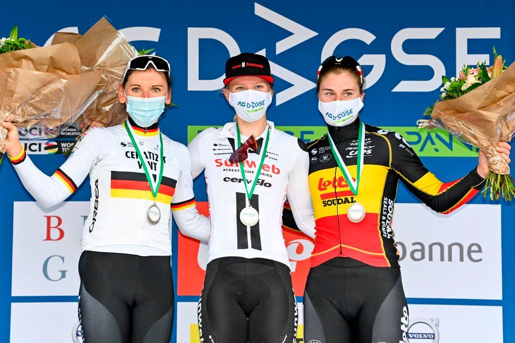 Winner Team Sunwebs Dutch Lorena Wiebes celebrates on the podium flanked by second Team CeratizitWNTs German Lisa Brennauer and third Team Lotto Soudals Belgian Lotte Kopecky after the womens elite stage of the Driedaagse Brugge De Panne cycling race 156km from Brugge to De Panne on October 20 2020 Photo by ERIC LALMAND BELGA AFP Belgium OUT Photo by ERIC LALMANDBELGAAFP via Getty Images