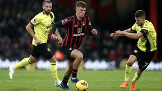 Alex Scott of AFC Bournemouth runs with the ball whilst under pressure from Johann Gudmundsson of Burnley during the Premier League match between AFC Bournemouth and Burnley FC at Vitality Stadium on October 28, 2023 in Bournemouth, England.