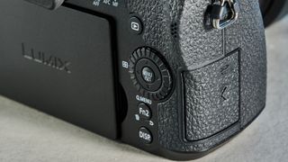 A black Panasonic Lumix G97 mirrorless camera