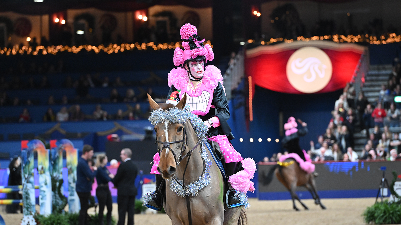 John Whitaker in the fancy dress jumping at London International