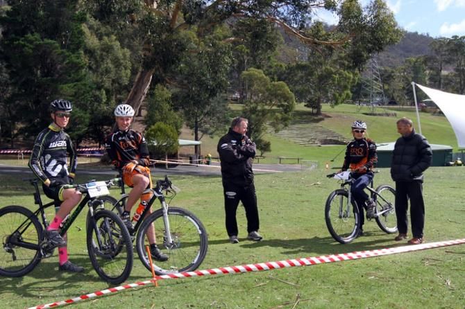 Riders spectate between heats