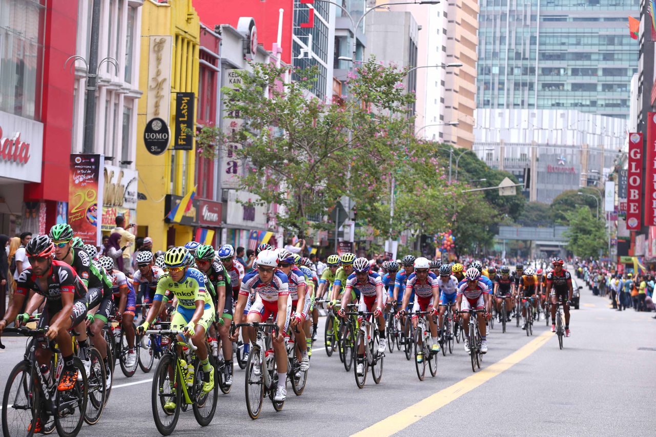 The peloton passes through the streets of Kuala Lumpur