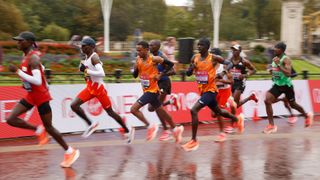 Eliud Kipchoge of Kenya leads his group as they compete in the Elite Men’s race during the 2020 London Marathon