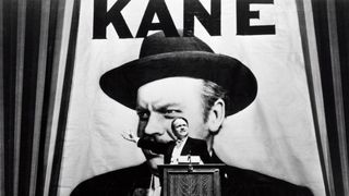 Charles Kane stands on stage for a speech in Citizen Kane