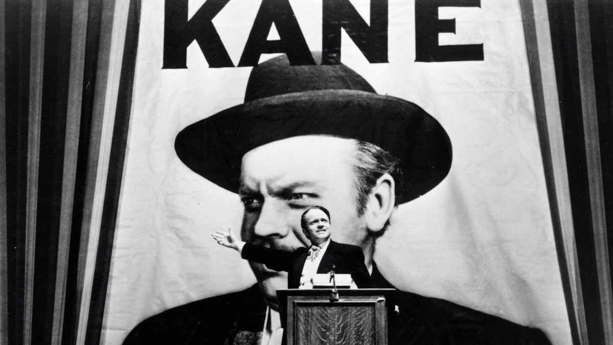 Charles Kane stands on stage for a speech in Citizen Kane