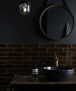 Black and dark brown bathroom with glossy tiles by Original Style