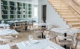 Dining space with stairs at Lurra restaurant London, UK