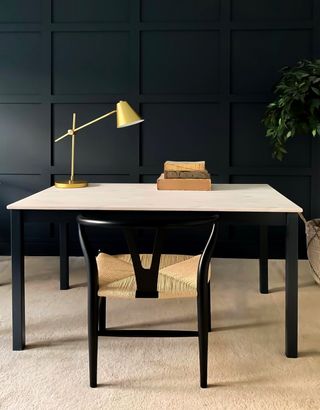 A work from home desk in all black with a muted table top made wit Ikea products