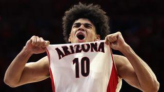 Koa Peat #10 of the Arizona Wildcats celebrates after scoring against the Arizona State Sun Devils during the second half of the NCAAB game at McKale Center on January 14, 2026 in Tucson, Arizona. The Wildcats defeated the Sun Devils 89-82.