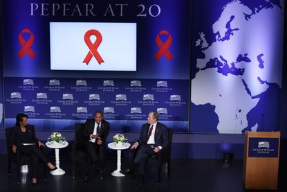 Former U.S. Secretary of State Condoleezza Rice, former President of Tanzania Jakaya Mrisho Kikwete and former U.S. President George W. Bush participate in a discussion during an event to mark the 20th anniversary of PEPFAR