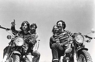 Creedence Clearwater Revival aboard two motorbikes