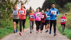 A multi-generational group of runners