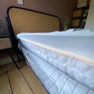 The Emma Hybrid Original mattress being tested by a female reviewer