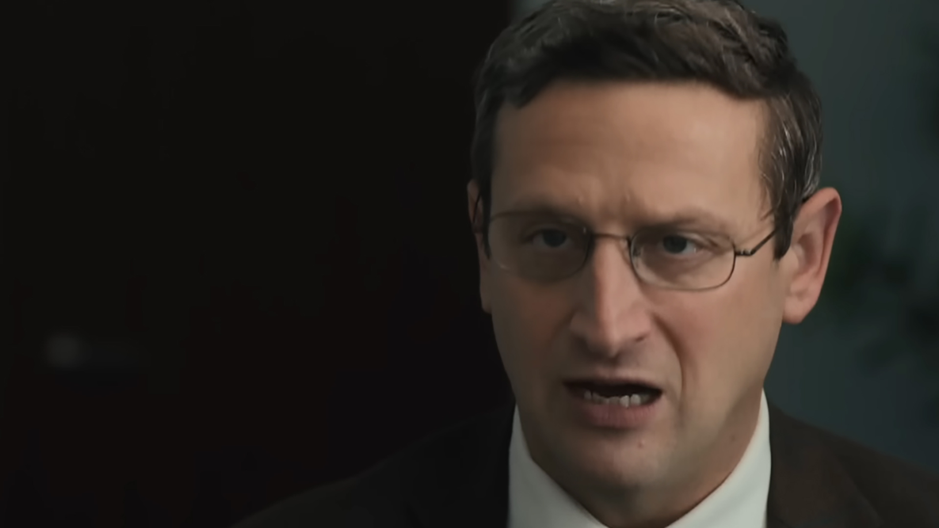 Tim Robinson as Ron Trosper, looking determined