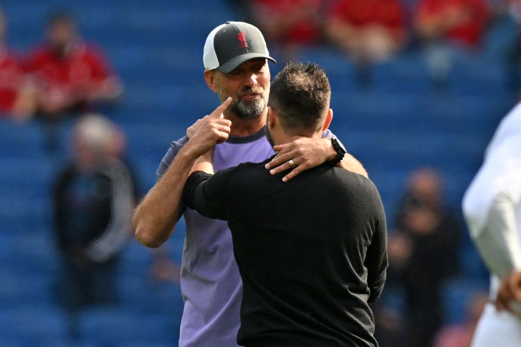 Liverpool&#039;s German manager Jurgen Klopp (L) shares a moment with Brighton&#039;s Italian head coach Roberto De Zerbi (R) ahead of the English Premier League football match between Brighton and Hove Albion and Liverpool at the American Express Community Stadium in Brighton, southern England on October 8, 2023. (Photo by Glyn KIRK / AFP) / RESTRICTED TO EDITORIAL USE. No use with unauthorized audio, video, data, fixture lists, club/league logos or &#039;live&#039; services. Online in-match use limited to 120 images. An additional 40 images may be used in extra time. No video emulation. Social media in-match use limited to 120 images. An additional 40 images may be used in extra time. No use in betting publications, games or single club/league/player publications. / (Photo by GLYN KIRK/AFP via Getty Images)