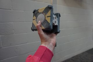 A miniature replica of an Astrobee robot.