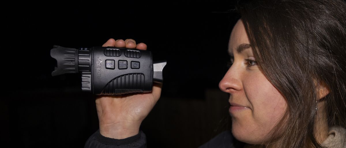 A female holding the Rexing B1 Basic night vision monocular