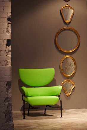 Cassina's collection includes a rather striking set of bright green 'Tre Pezzi' armchairs