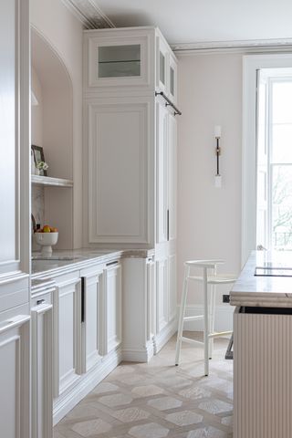 White kitchen with walls in Holland Park by Mylands