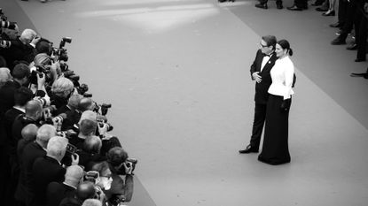 Benoît Magimel and Juliette Binoche attend the "La Passion De Dodin Bouffant" red carpet during the 76th annual Cannes film festival